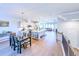 Open-concept living space with hardwood floors connecting the kitchen, dining area, and living room, great for entertaining at 361 Watson Ave, Woodstock, GA 30189