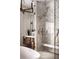 Bathroom showcasing the glass shower with marble walls and gold hardware at 79 Beverly Ne Rd, Atlanta, GA 30309