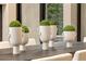 Close up of dining table with a dark wood top and five decorative vases with greenery inside at 79 Beverly Ne Rd, Atlanta, GA 30309