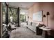 Stylish living room filled with natural light, featuring a gray sofa and glass coffee table at 79 Beverly Ne Rd, Atlanta, GA 30309