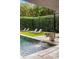 Inviting backyard featuring a swimming pool with fountain and lounge chairs, surrounded by lush greenery at 79 Beverly Ne Rd, Atlanta, GA 30309