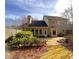 A home's backyard features a stone patio, well-maintained landscaping, and plenty of space for outdoor entertaining at 7155 Roswell Rd # 37, Sandy Springs, GA 30328