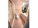 Well-lit bathroom with a vanity, toilet, and glass-enclosed tub-shower combo at 7155 Roswell Rd # 37, Sandy Springs, GA 30328