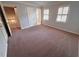 Large bedroom featuring neutral walls and carpet with natural light at 7155 Roswell Rd # 37, Sandy Springs, GA 30328