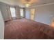 Spacious primary bedroom with large windows, ceiling fan and ensuite bathroom at 7155 Roswell Rd # 37, Sandy Springs, GA 30328