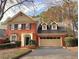 Charming brick home featuring a two-car garage and well-manicured landscaping at 7155 Roswell Rd # 37, Sandy Springs, GA 30328