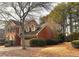Brick home showcasing architectural details and mature trees on a spacious lot at 7155 Roswell Rd # 37, Sandy Springs, GA 30328