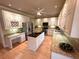 Bright kitchen featuring white cabinetry, granite countertops, and a center island at 7155 Roswell Rd # 37, Sandy Springs, GA 30328