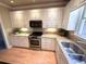 Updated kitchen showcasing granite countertops, stainless appliances, and ample cabinet space at 7155 Roswell Rd # 37, Sandy Springs, GA 30328