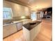 Bright kitchen with island, stainless appliances, granite countertops, and natural light at 7155 Roswell Rd # 37, Sandy Springs, GA 30328