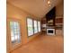 Spacious living room with fireplace, built-ins, and lots of natural light at 7155 Roswell Rd # 37, Sandy Springs, GA 30328