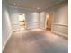Open living room featuring neutral walls and entryways to other rooms at 7155 Roswell Rd # 37, Sandy Springs, GA 30328