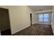 Bright bedroom with plush carpeting, large windows, and ample closet space at 911 Redwood Dr, Norcross, GA 30093