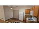 View of kitchen featuring granite countertops, ample cabinet space, and modern appliances at 911 Redwood Dr, Norcross, GA 30093