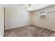 Bedroom features carpet flooring, neutral walls, and a large window with exterior view at 1106 Hampton Ne Way, Atlanta, GA 30324