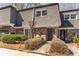 Charming townhome with brick facade, gray roof, and neatly trimmed landscaping at 1106 Hampton Ne Way, Atlanta, GA 30324