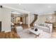 Open-concept living room with wood floors seamlessly connecting to the dining area and staircase at 1106 Hampton Ne Way, Atlanta, GA 30324