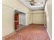Sunroom with brick flooring, view of kitchen and backyard access at 1106 Hampton Ne Way, Atlanta, GA 30324