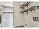 The utility room has built-in shelving and hookups for a washer and dryer at 1106 Hampton Ne Way, Atlanta, GA 30324