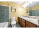 Bathroom featuring vanity with granite countertop, tiled floor, and a shower with glass door at 2101 Newgate Dr, Decatur, GA 30035