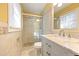 Bathroom featuring tiled shower, vanity with marble countertop, and a large mirror at 2101 Newgate Dr, Decatur, GA 30035