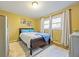 Bedroom with grey flooring, bright window and neutral paint colors at 2101 Newgate Dr, Decatur, GA 30035