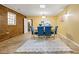 Dining room with rustic brick accent wall, tile floor, and a plush white rug at 2101 Newgate Dr, Decatur, GA 30035