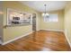 Dining room featuring hardwood floors, and a view to the adjacent white kitchen at 2101 Newgate Dr, Decatur, GA 30035