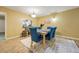 Dining room with six chairs, a bright window, and rug with neutral paint colors at 2101 Newgate Dr, Decatur, GA 30035