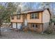 Charming split-level home with brick and siding, featuring a two-car garage and cozy front porch at 2101 Newgate Dr, Decatur, GA 30035