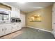 Kitchen with white cabinets and countertops, stainless steel appliances, and view to dining room at 2101 Newgate Dr, Decatur, GA 30035