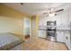 Well-lit kitchen with white cabinets, stainless steel appliances, and granite countertops at 2101 Newgate Dr, Decatur, GA 30035