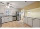Well-lit kitchen with white cabinets, stainless steel appliances, and tile floors at 2101 Newgate Dr, Decatur, GA 30035