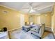 Living room featuring soft seating, a bright window, ceiling fan, and grey flooring at 2101 Newgate Dr, Decatur, GA 30035