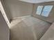 Carpeted bedroom featuring two windows that fill the room with light at 265 Edinburgh Ln, Woodstock, GA 30188