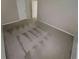 Bright bedroom with carpet, neutral walls, and a door to another room at 265 Edinburgh Ln, Woodstock, GA 30188