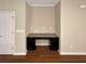 Built-in desk area with granite countertop and dark cabinetry, adjacent to a door and wall outlets at 265 Edinburgh Ln, Woodstock, GA 30188