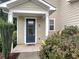 Inviting entryway with a decorative front door, well-kept landscaping, and a welcoming porch at 265 Edinburgh Ln, Woodstock, GA 30188