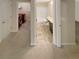 Hallway view looking into the laundry room and bathroom; offering plenty of storage at 265 Edinburgh Ln, Woodstock, GA 30188