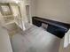 Spacious loft featuring neutral carpeting and a built-in desk with dark cabinetry at 265 Edinburgh Ln, Woodstock, GA 30188
