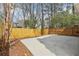 A large concrete patio and wood fence surround this home, offering privacy and space at 2979 Grey Squirrel Se Ct, Marietta, GA 30067