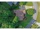 An aerial view of a charming home on a spacious lot, surrounded by lush trees and a well-manicured lawn at 403 Glenhurst Trce, Canton, GA 30115
