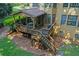 Overhead angle shows backyard with stairs to deck & screened porch, and lush landscaping at 403 Glenhurst Trce, Canton, GA 30115