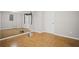 Finished basement featuring a large mirror on the wall and durable floors, perfect for a home gym or recreation area at 403 Glenhurst Trce, Canton, GA 30115
