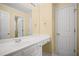 Bright bathroom with white cabinetry, sink, and vanity, providing ample counter space and storage at 403 Glenhurst Trce, Canton, GA 30115