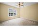 A cozy bedroom with neutral carpet, light yellow walls, and a ceiling fan providing comfort at 403 Glenhurst Trce, Canton, GA 30115