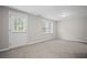 Bedroom featuring a door to the exterior and two windows at 403 Glenhurst Trce, Canton, GA 30115