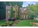 Stunning two-story brick home with lush landscaping and a well-manicured lawn creates lovely curb appeal at 403 Glenhurst Trce, Canton, GA 30115
