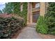 The front entrance has a double door, and is surrounded by lush greenery and shrubbery at 403 Glenhurst Trce, Canton, GA 30115