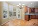 Bright kitchen with granite counters, wood cabinets and stainless appliances overlooks dining area at 403 Glenhurst Trce, Canton, GA 30115